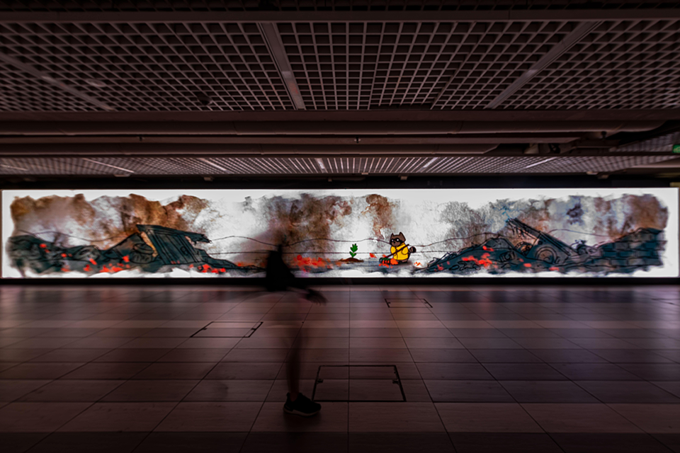 LED screen in a corridor displaying digital art.