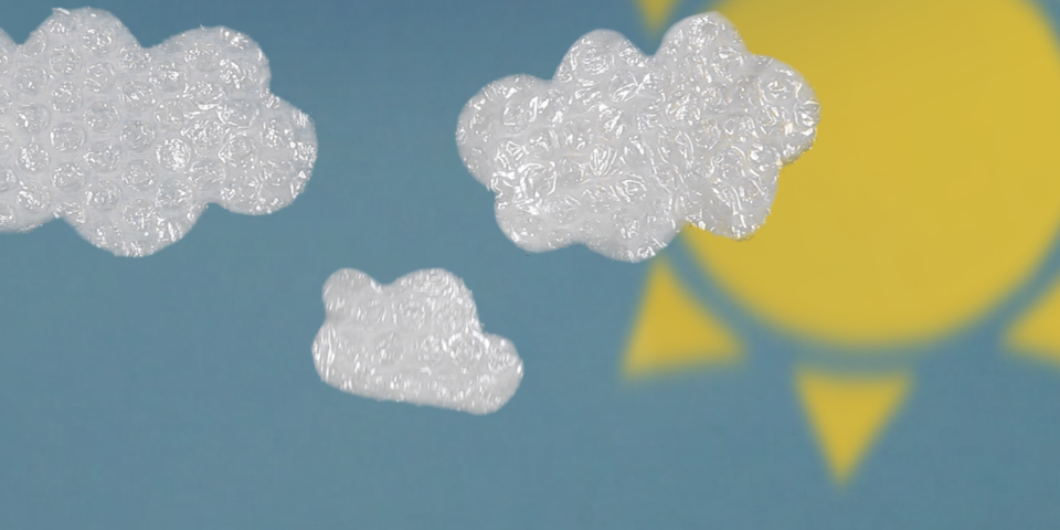 Paper artwork of clouds and the sun.
