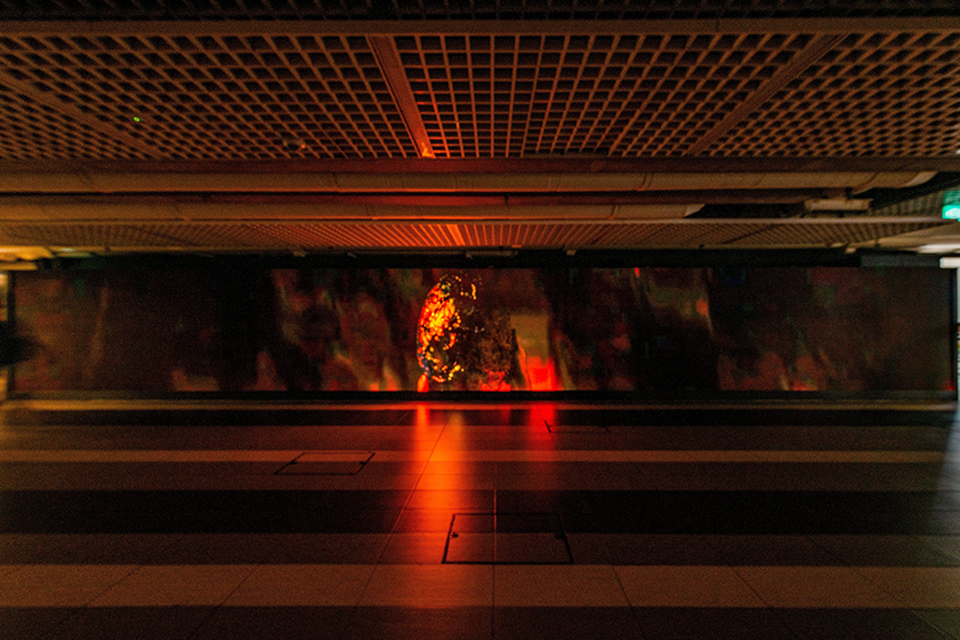 LED screen in a corridor displaying digital art