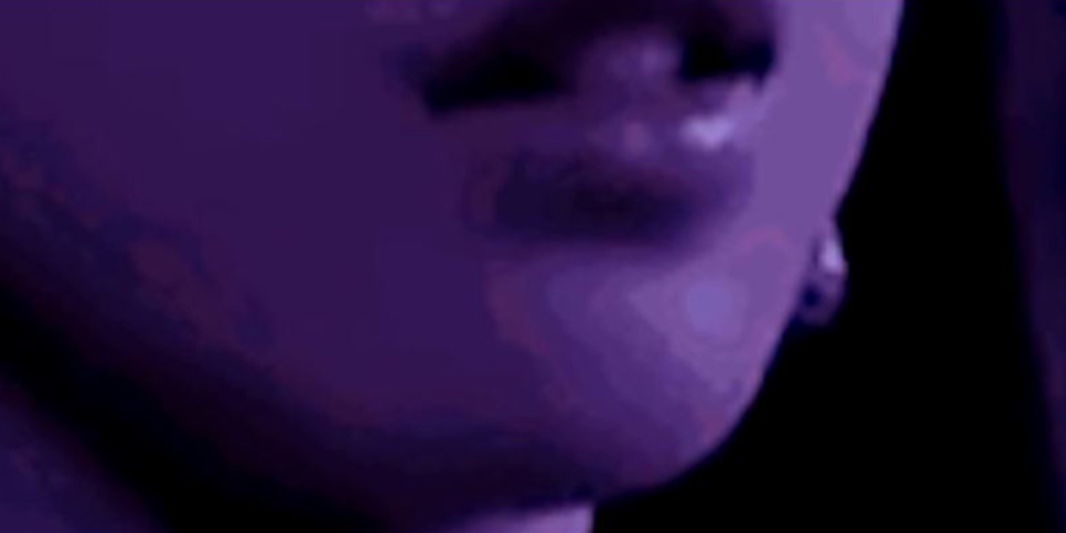 Artwork of a girls lips and chin close up, with a purple tint over the art
