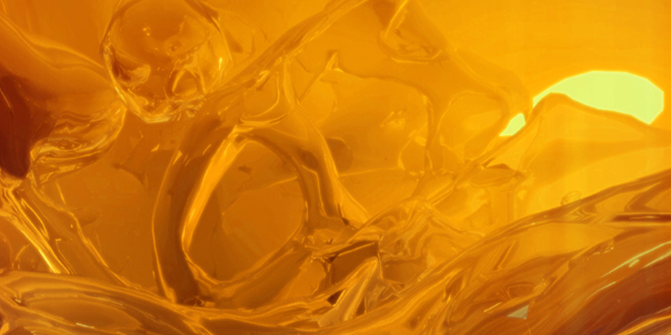 Digital artwork of an orange liquid swirling around.